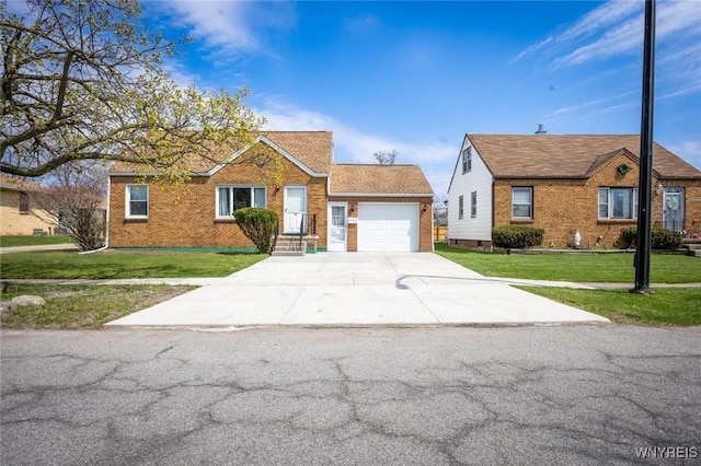view of front of home featuring a garage, brick siding, a front yard, and concrete driveway