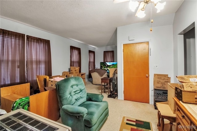 carpeted living room featuring ceiling fan