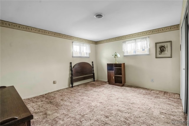 sitting room featuring carpet flooring
