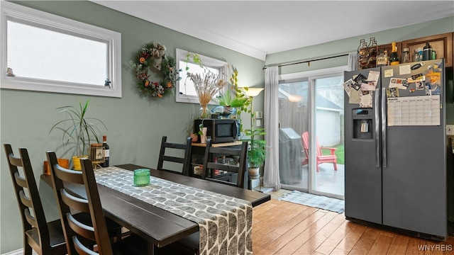 dining space with light wood-style flooring