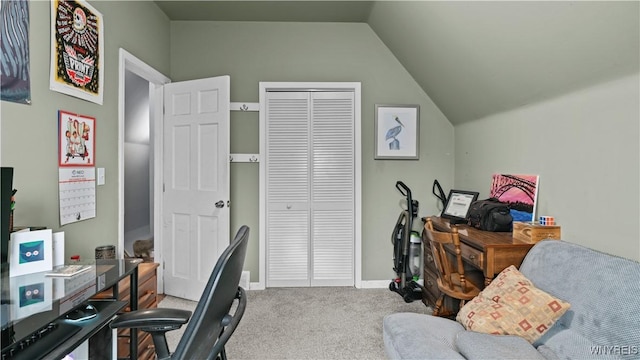 office space featuring carpet floors, baseboards, and vaulted ceiling