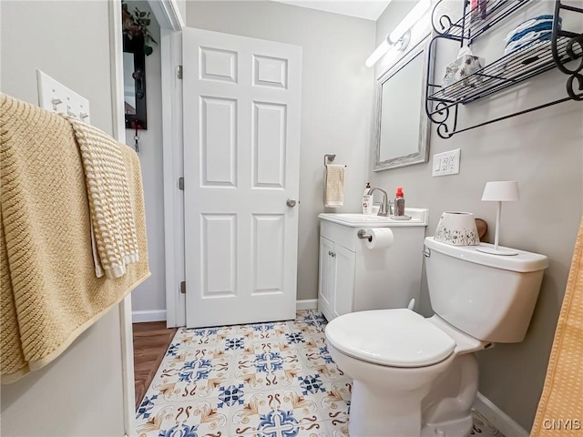 11188 Westdale Rd Unit 6, Florence, NY 13483 - bathroom featuring baseboards, toilet, and vanity