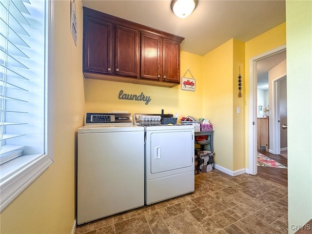 11188 Westdale Rd Unit 6, Florence, NY 13483 - clothes washing area featuring cabinet space, separate washer and dryer, baseboards, and stone finish floor
