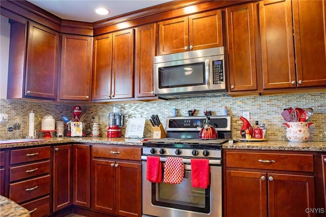 11188 Westdale Rd Unit 6, Florence, NY 13483 - kitchen featuring backsplash, a sink, appliances with stainless steel finishes, and light stone counters