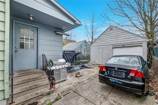view of property exterior featuring a garage and an outbuilding