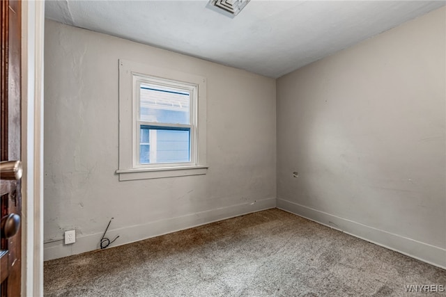 unfurnished room with visible vents, carpet flooring, and baseboards