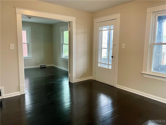 625 22nd St, Niagara Falls, NY 14301 - doorway to outside featuring visible vents, dark wood-style flooring, and baseboards
