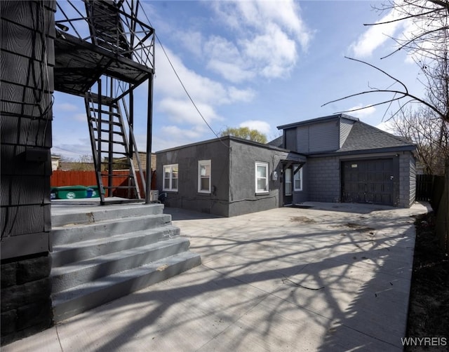 625 22nd St, Niagara Falls, NY 14301 - exterior space featuring stairway, fence, driveway, and a garage