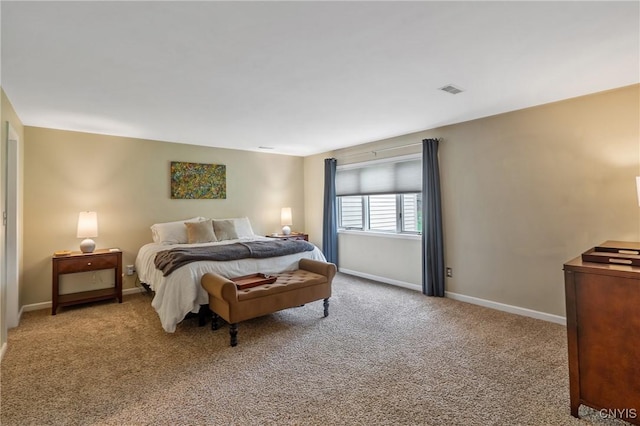 carpeted bedroom with baseboards and visible vents