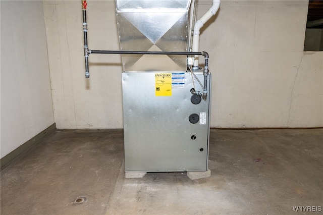utility room with heating unit