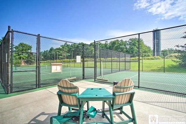 view of tennis court with fence