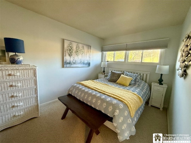 carpeted bedroom with baseboards