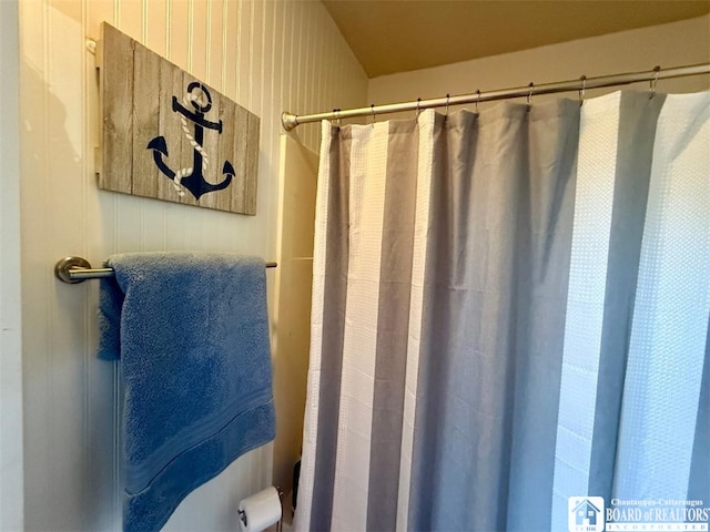 bathroom with a shower with curtain