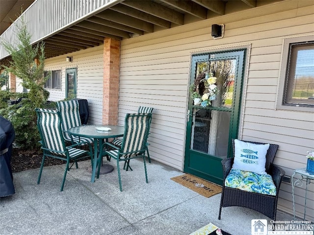 view of patio featuring outdoor dining area