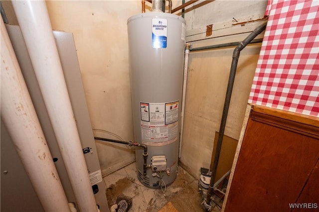 utility room featuring gas water heater