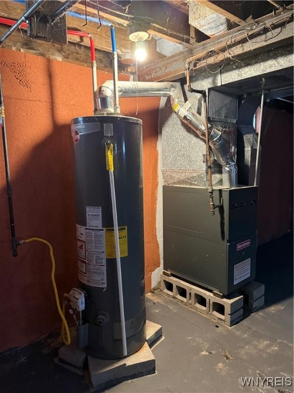 utility room with gas water heater