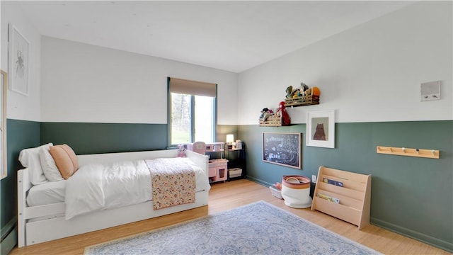 bedroom featuring wood finished floors