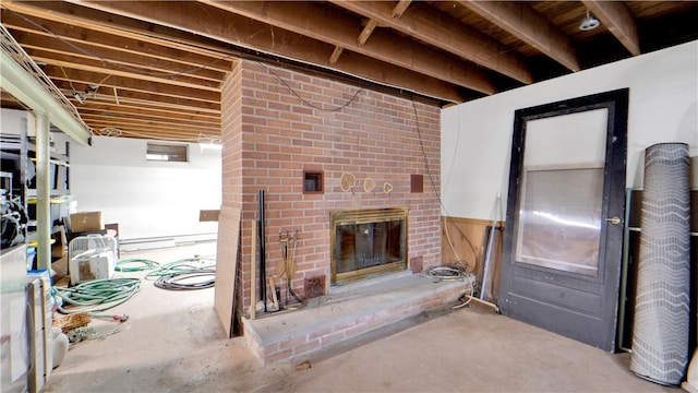 below grade area featuring a brick fireplace