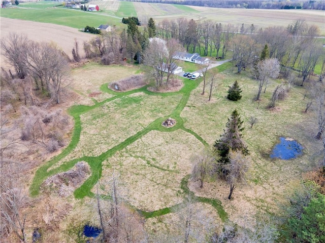 birds eye view of property featuring a rural view