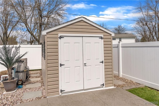 view of shed with a fenced backyard
