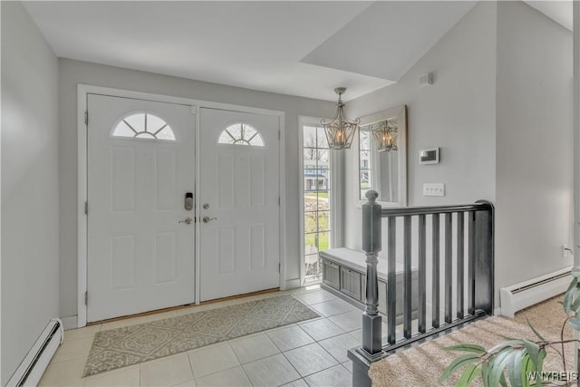 entrance foyer featuring light tile patterned flooring, a notable chandelier, and a baseboard radiator