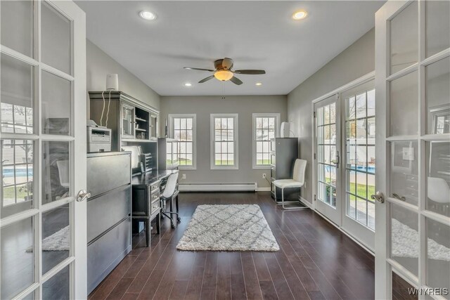 office area with a healthy amount of sunlight, ceiling fan, baseboard heating, and french doors