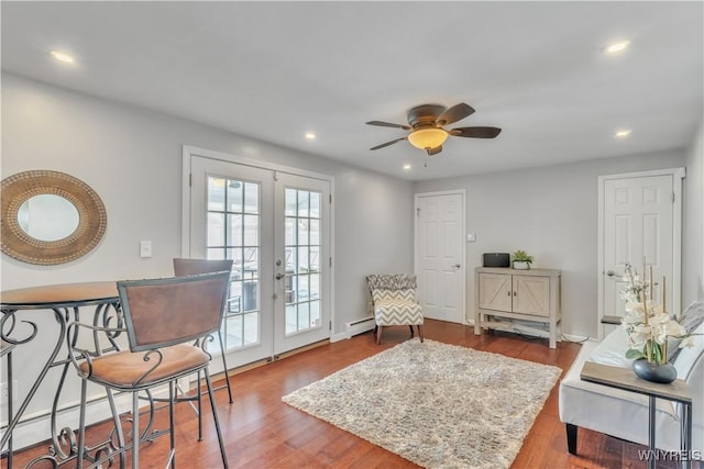 living area featuring ceiling fan, french doors, recessed lighting, wood finished floors, and a baseboard radiator