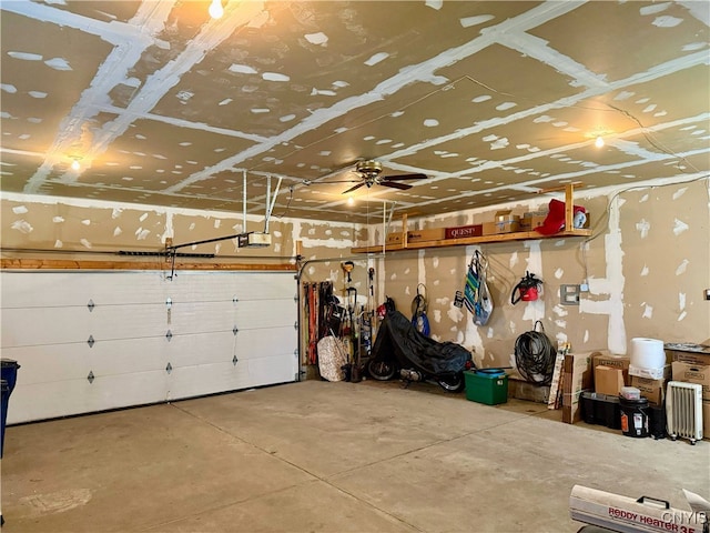 garage featuring a garage door opener and a ceiling fan