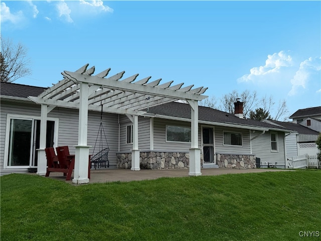 back of property featuring a lawn, a pergola, a chimney, and a patio