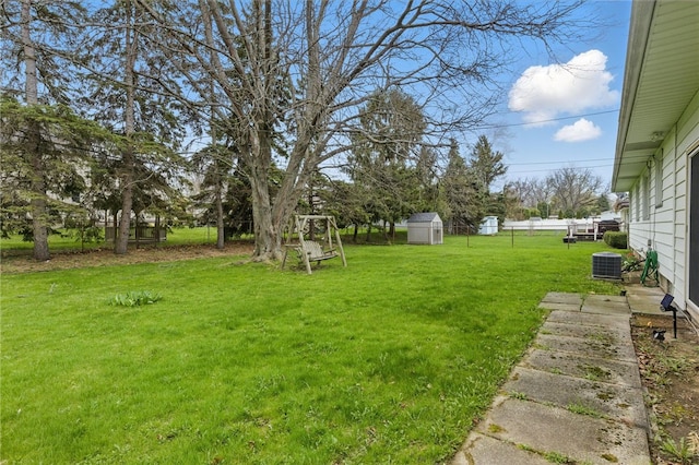 view of yard featuring an outbuilding and cooling unit