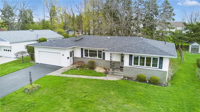 single story home with a garage, a front lawn, aphalt driveway, a chimney, and a shingled roof