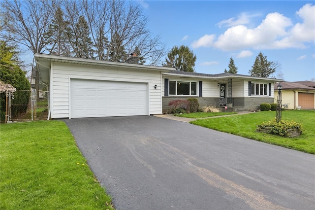ranch-style home with driveway, a front yard, a garage, fence, and stone siding