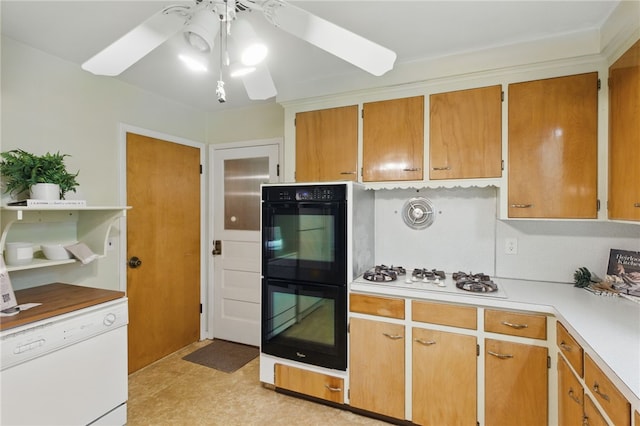 kitchen featuring light countertops, a ceiling fan, and white appliances