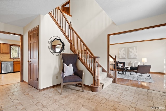 staircase with tile patterned floors and baseboards