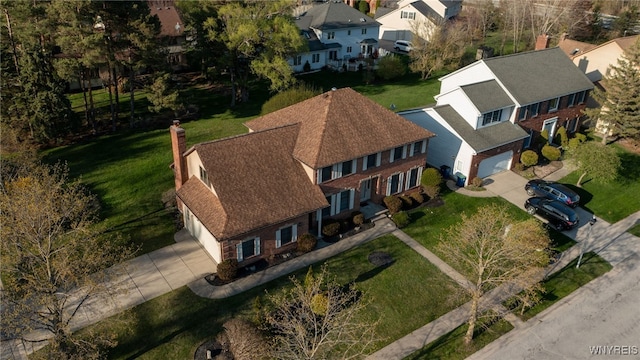 birds eye view of property with a residential view