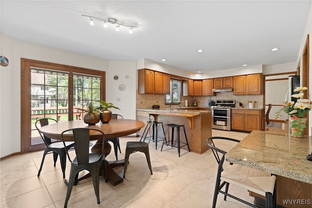 dining space featuring recessed lighting and a wealth of natural light