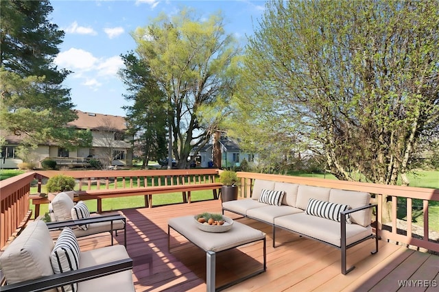 wooden terrace featuring an outdoor hangout area