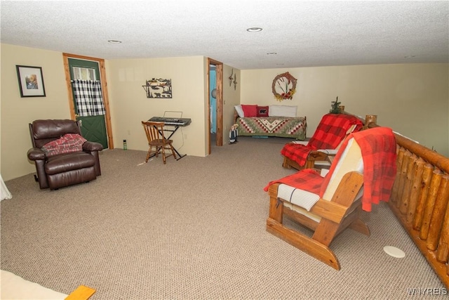 bedroom featuring carpet floors and a textured ceiling
