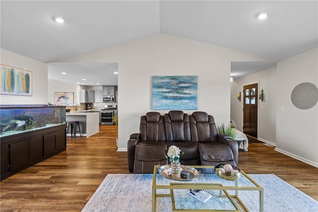 living room featuring baseboards, recessed lighting, wood finished floors, and vaulted ceiling
