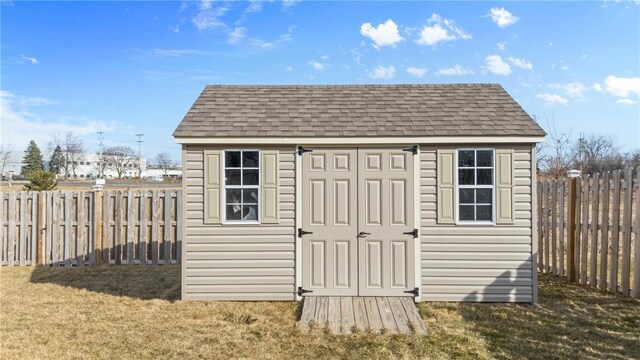 view of shed featuring a fenced backyard