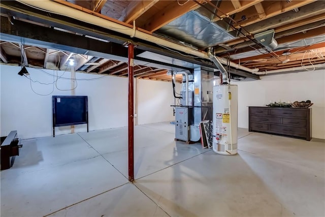 unfinished below grade area featuring water heater and heating unit