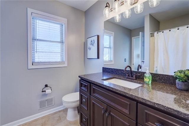 bathroom featuring visible vents, tile patterned flooring, vanity, toilet, and baseboards