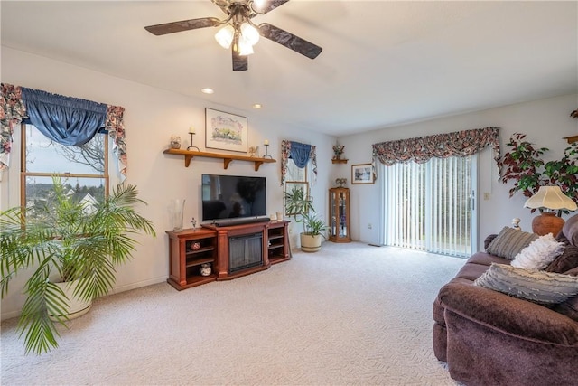carpeted living room featuring recessed lighting and a ceiling fan