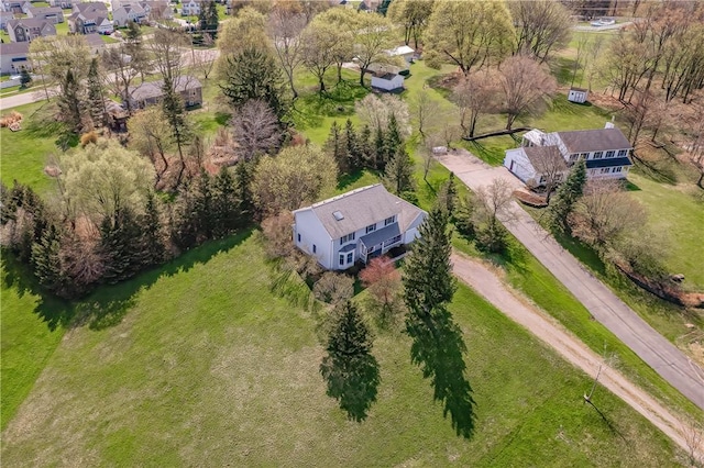 birds eye view of property with a residential view