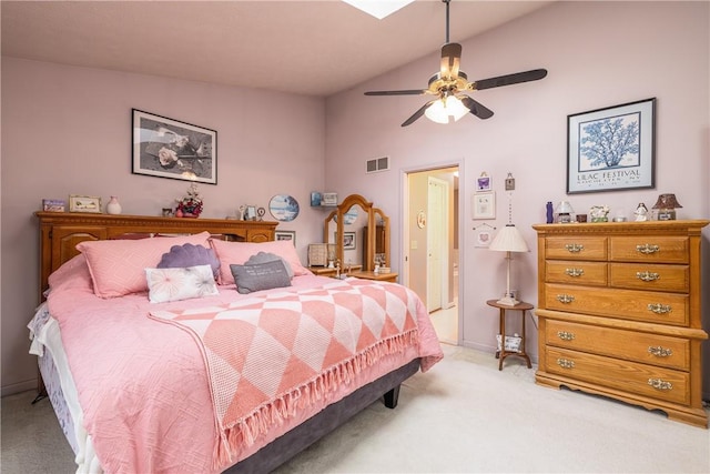 bedroom featuring visible vents, ceiling fan, lofted ceiling, and light carpet