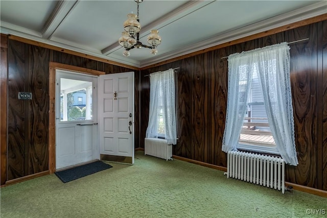 427 S James St, Wilna, NY 13619 - carpeted foyer featuring wood walls, a notable chandelier, and radiator