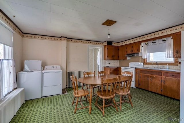 427 S James St, Wilna, NY 13619 - dining room featuring radiator, plenty of natural light, and washing machine and clothes dryer