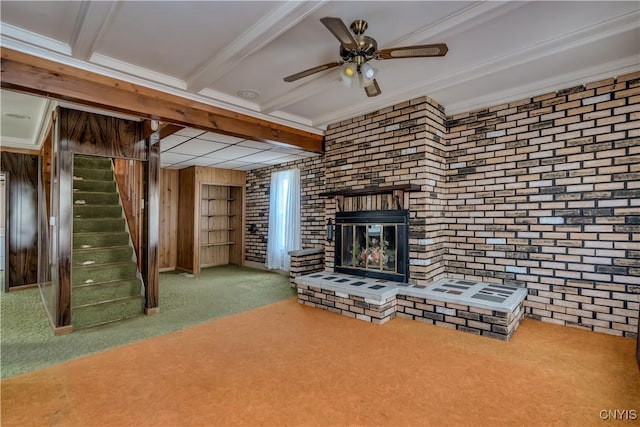 427 S James St, Wilna, NY 13619 - unfurnished living room featuring carpet flooring, brick wall, and stairway
