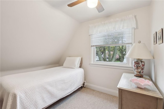 bedroom with carpet floors, baseboards, ceiling fan, and lofted ceiling