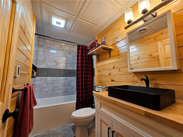 full bathroom featuring wood walls, vanity, an ornate ceiling, toilet, and shower / tub combo with curtain
